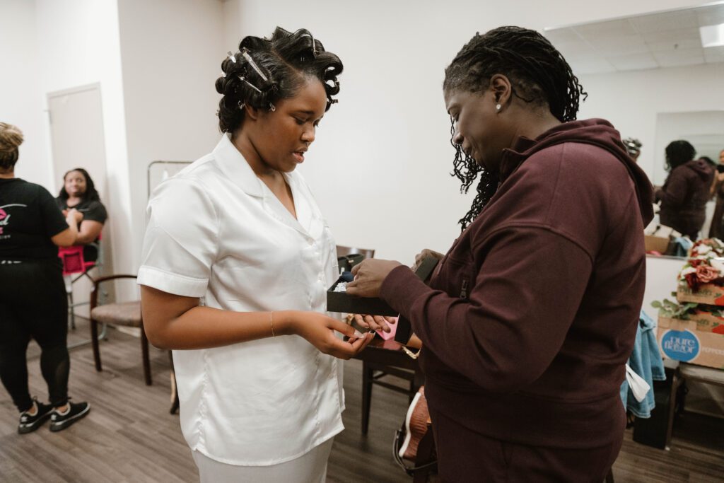 Candid wedding photo of mother with bride, captured by Huntsville documentary wedding photographer.